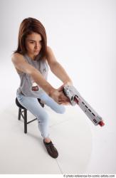MOLLY SITTING POSE WITH GUN